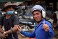 Happy cambodian man showing Ã¢â¬ÅokÃ¢â¬Â gesture